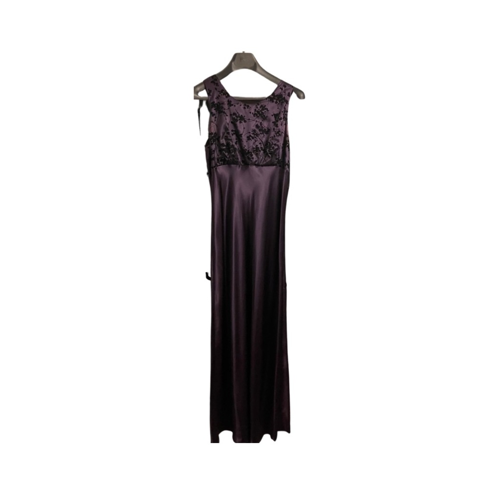Formal purple dress with velvet flowers.